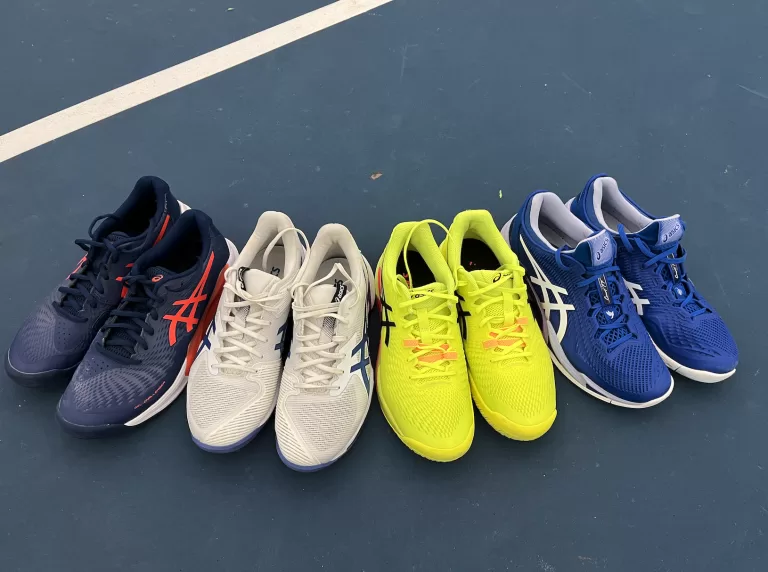 Four pairs of Asics tennis shoes